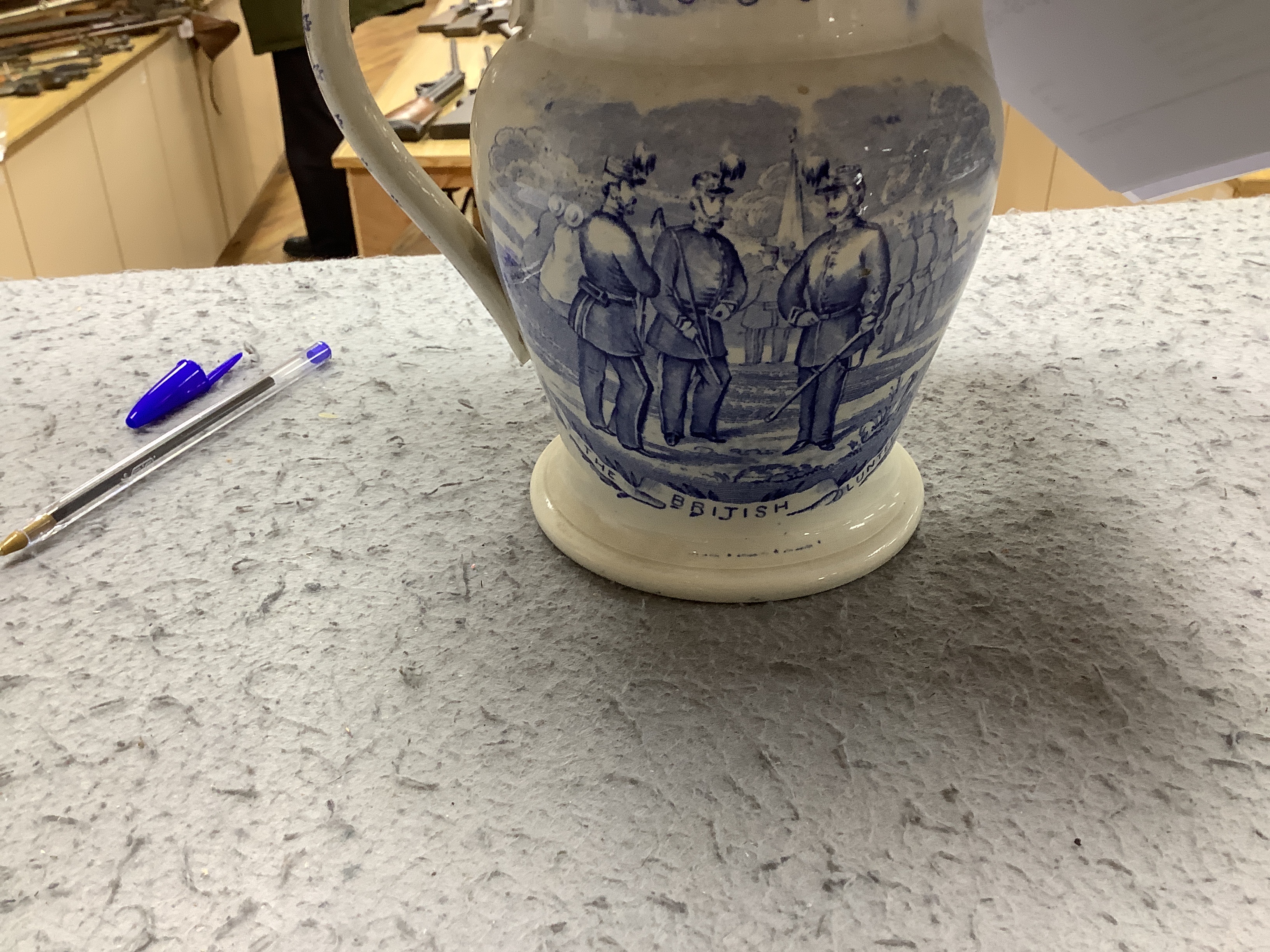 Seven military and naval themed jugs including a Leeds creamware jug 'Loyal Volunteers' inscribed 'L Volnteers' c.1803, an early 19th century success to the volunteers jug, a Sunderland pink splash lustre loving cup etc.